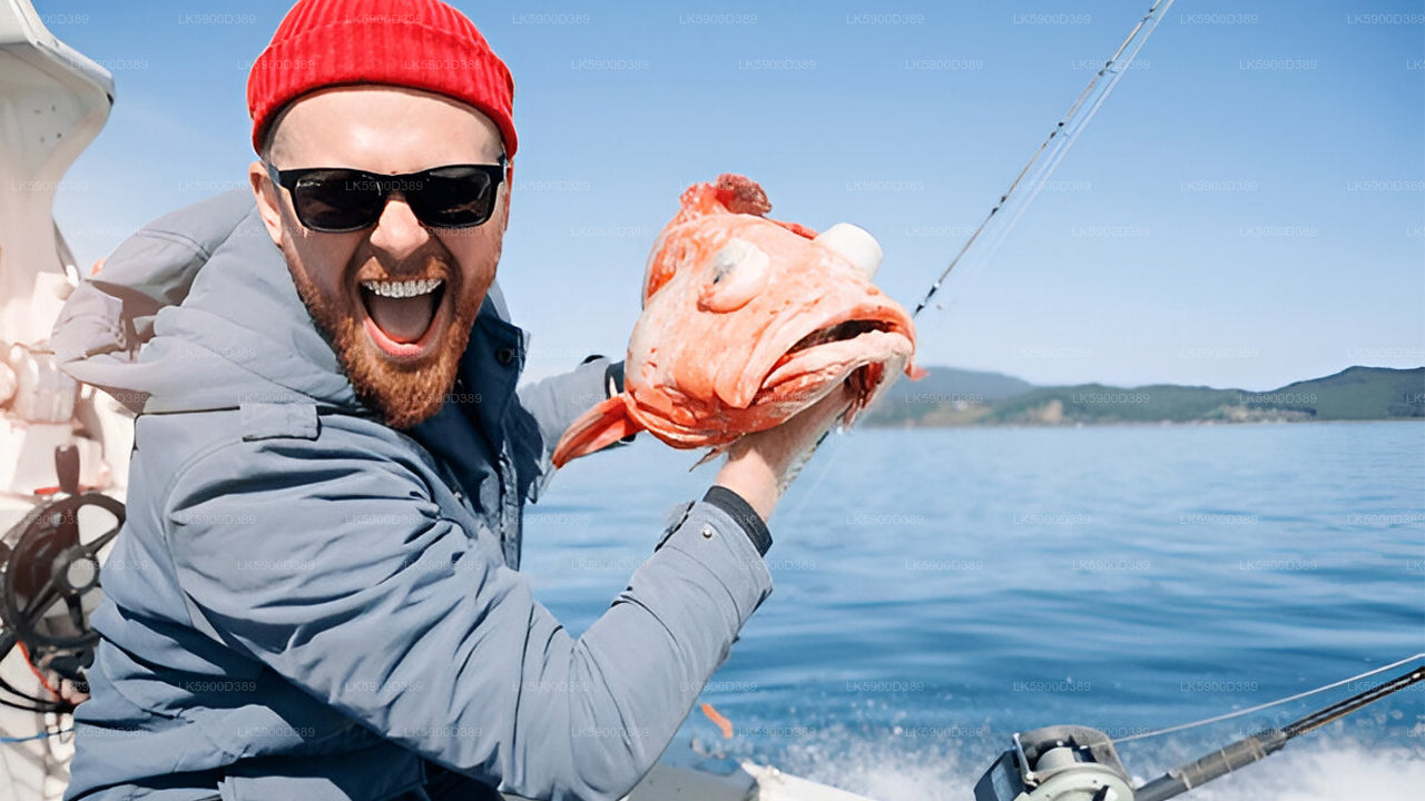 Person on a boat holding a large fish, smiling.